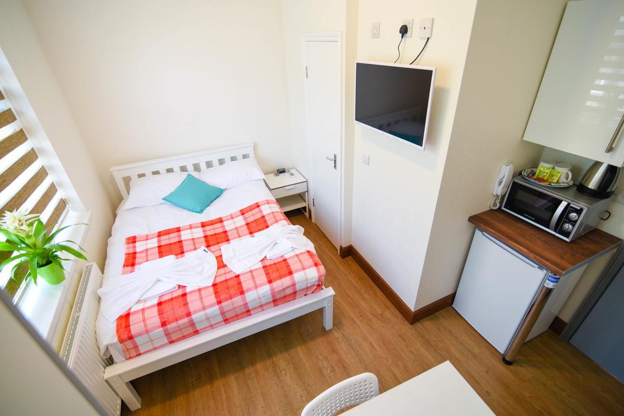 Green Suites Londres Quarto foto
